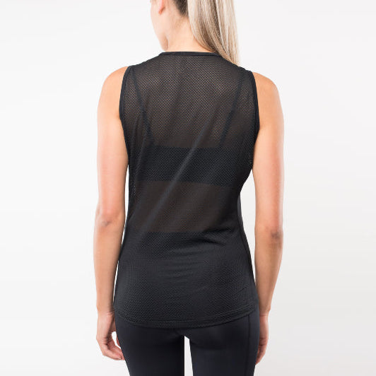 Back view of woman wearing black cycling base layer mesh top on a white background