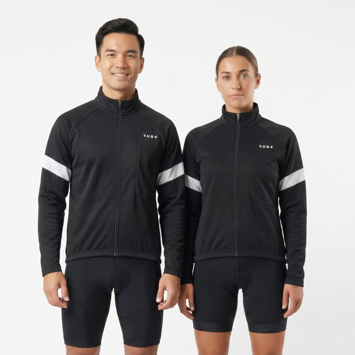 Person wearing black cycling jersey and shorts with white reflective accents on a light gray background