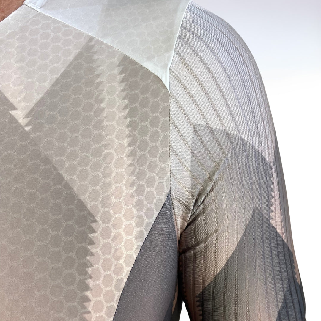 Close-up of a textured fabric with geometric patterns on a white background