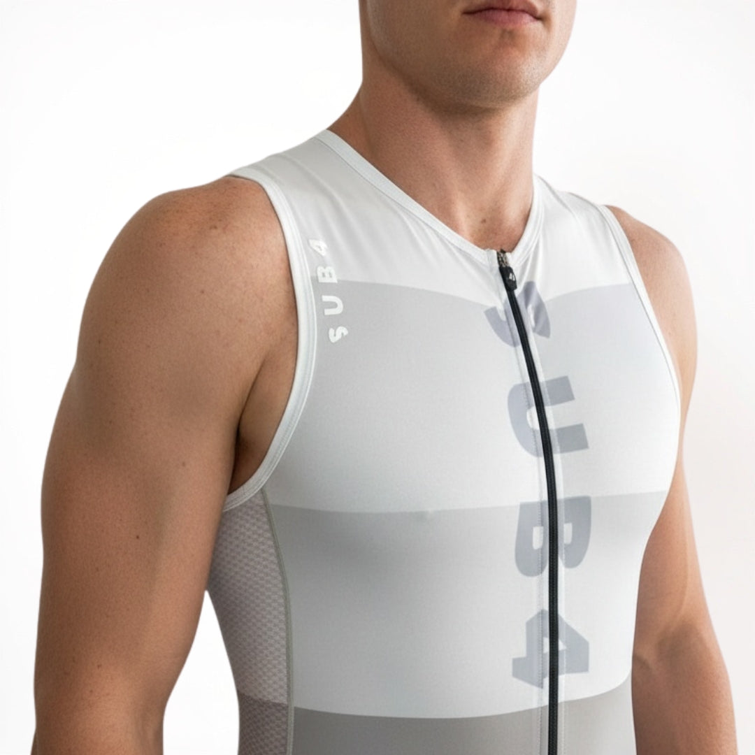 Person wearing a white sleeveless athletic outfit with branding on a white background
