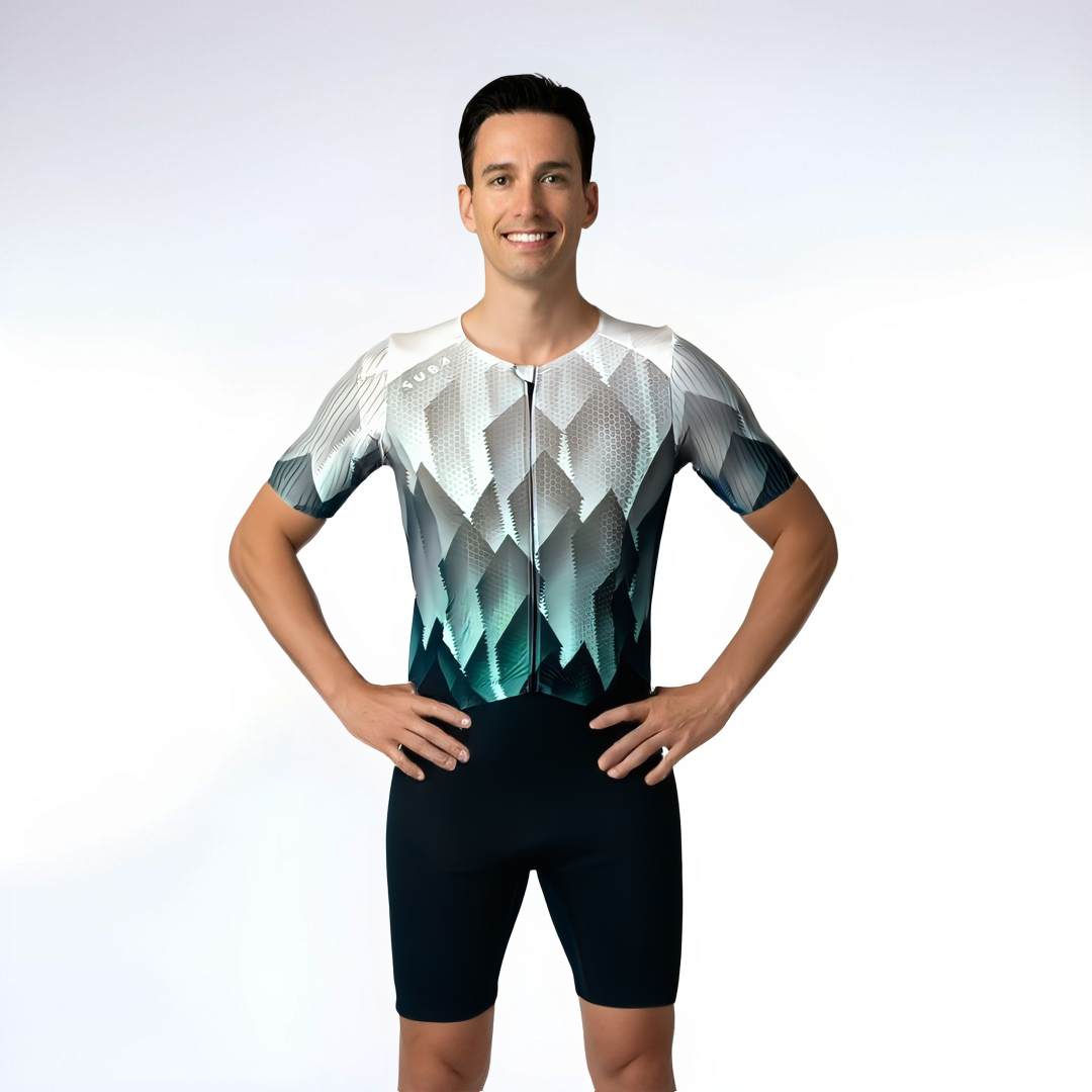 Man wearing a geometric patterned cycling outfit on a white background