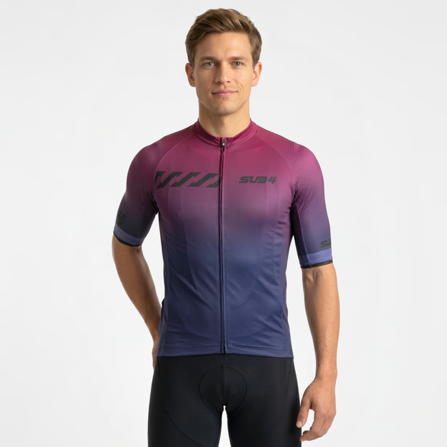 Man wearing a gradient cycling jersey on a plain background