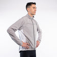 Man wearing a gray jacket on a white background