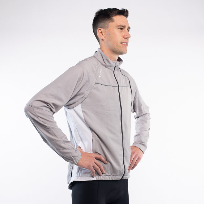 Man wearing a gray jacket on a white background