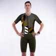 Person wearing a green and black athletic suit with 'SUB4' branding on a white background