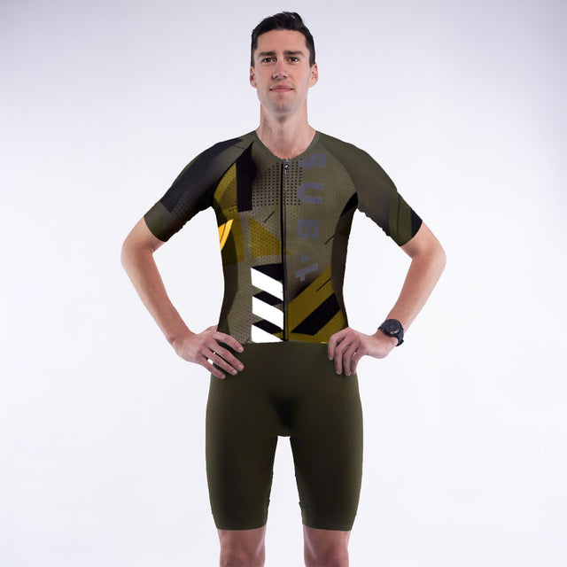 Person wearing a green and black athletic suit with 'SUB4' branding on a white background