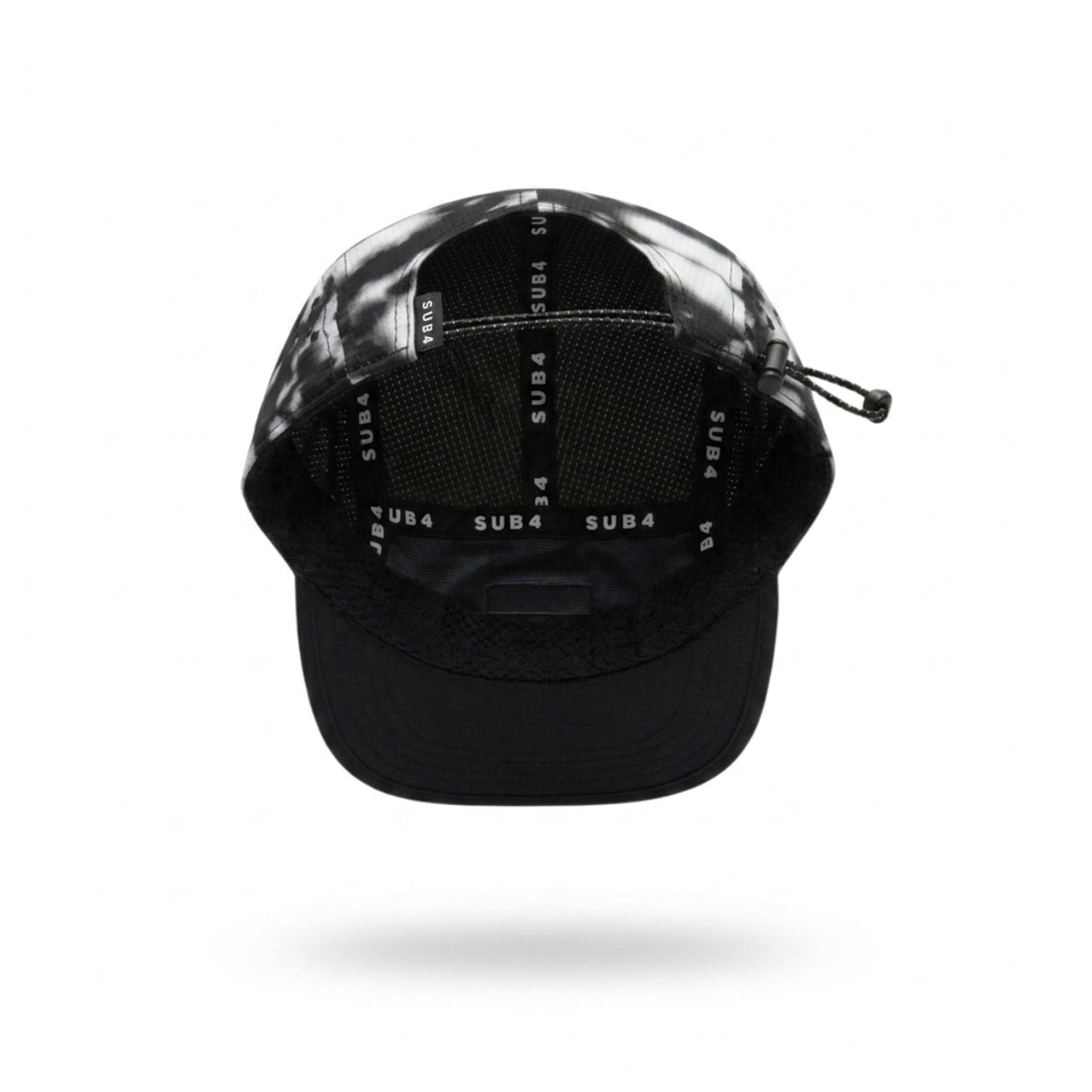 A black and grey running cap with a small white 'SUB4' logo patch on the side, shown floating against a white background with a soft shadow underneath.