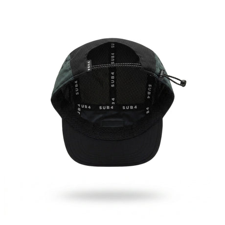 A black and coal teal running cap with a small white 'SUB4' logo patch on the side, shown floating against a white background with a soft shadow underneath.