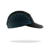 A black and coal teal running cap with a small white 'SUB4' logo patch on the side, shown floating against a white background with a soft shadow underneath.