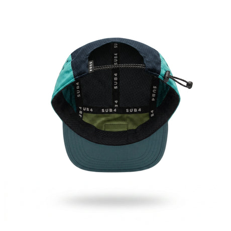 A neon yellow, turquoise and navy running cap with a small white 'SUB4' logo patch on the side, shown floating against a white background with a soft shadow underneath.