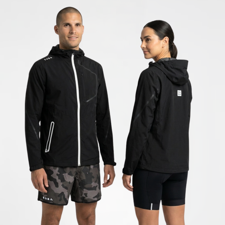 Man and woman wearing black waterproof jacket with visible branding on a white background