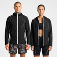 Man and woman wearing black waterproof jackets and shorts with SUB4 branding on a white background