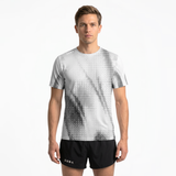 Person wearing a light grey running t-shirt with black patterns and black running shorts on a white background