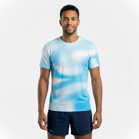 Person wearing a sky blue running t-shirt with patterns and navy running shorts on a white background