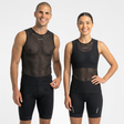 Man and woman wearing black cycling base layer mesh top on a white background