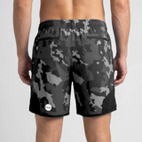 Black camouflage shorts worn by a person on a light gray background