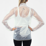 Back view of woman wearing a unisex translucent white long-sleeve rain jacket with SUB4 brand logo on a light gray background