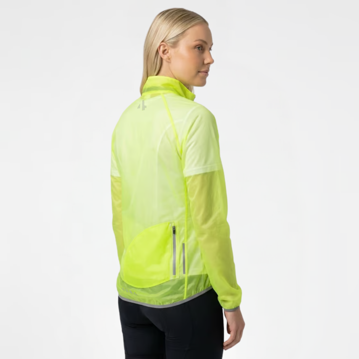 Side view of woman wearing fluro-yellow translucent rain jacket