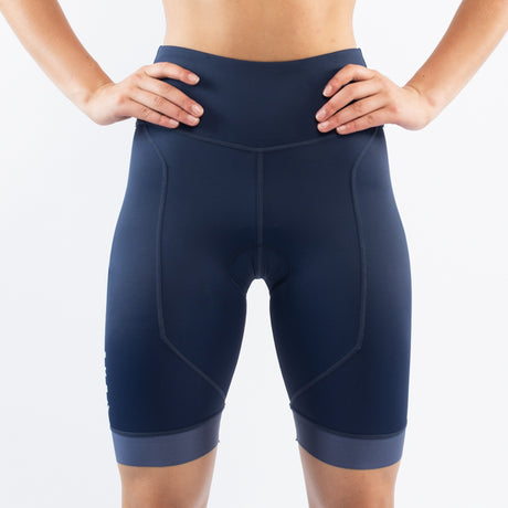 Navy blue athletic triathlon shorts worn by a person on a white background