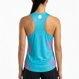 Person wearing a blue athletic tank top with a gradient design on a white background