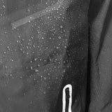 Close-up of a waterproof rain jacket with water droplets on the fabric