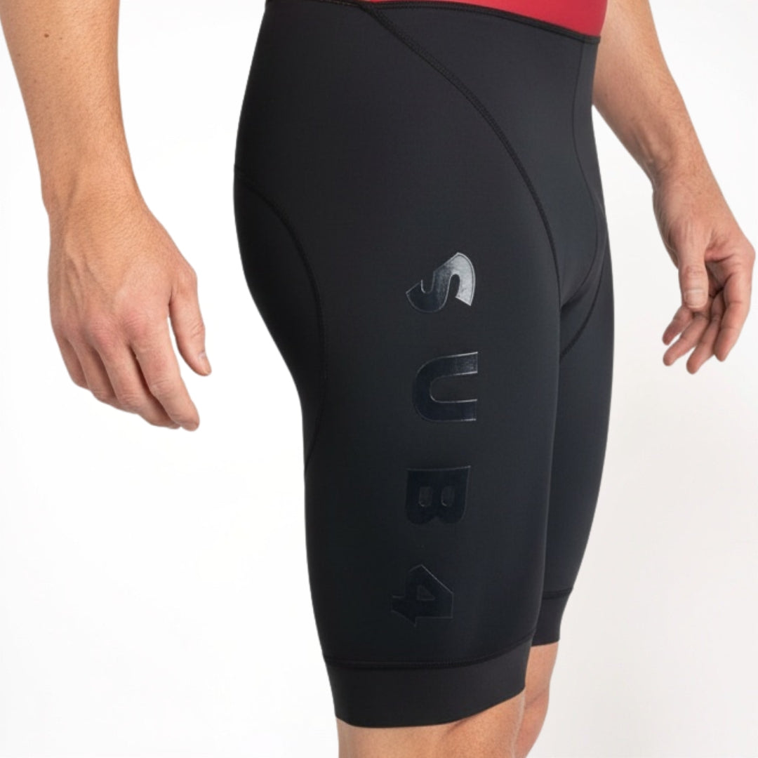 Black Tri suit shorts with a brand logo on a white background