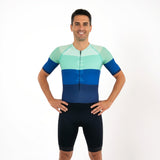 Man wearing a colourful Triathlon suit on a white background