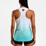 Woman wearing a white and blue dot geometric gradient tank top on a white background