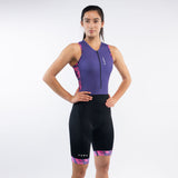 Woman wearing a purple and black athletic outfit with 'SUB4' branding on a white background