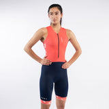 Woman wearing a rose and black athletic outfit on a white background