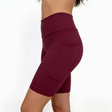 Maroon athletic shorts on a white background
