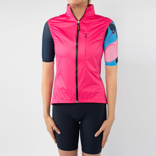 Person wearing a pink cycling vest with blue sleeves on a white background