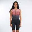 Woman wearing a black and pink gradient sleeveless Tri suit on a white background