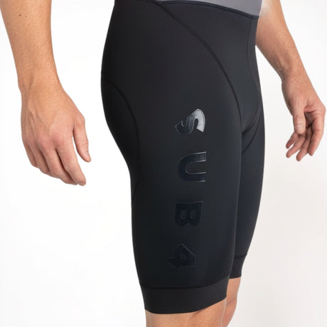 Black Tri Suit shorts with a brand logo on a white background