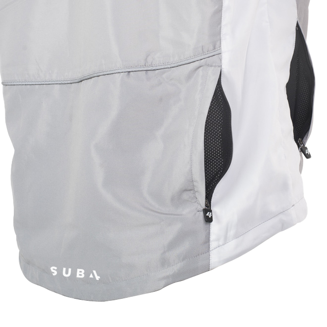Close-up of a gray jacket with a visible brand logo on a white background