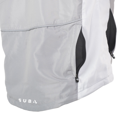 Close-up of a gray jacket with a visible brand logo on a white background